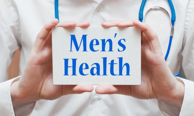 doctor-holding-up-sign-of-mens-health
