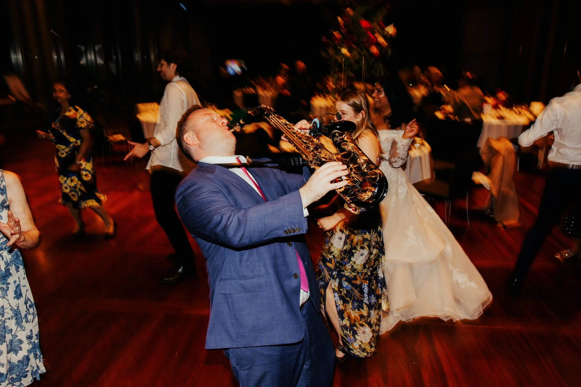 man-playing-saxophone-on-dance-floor-wedding