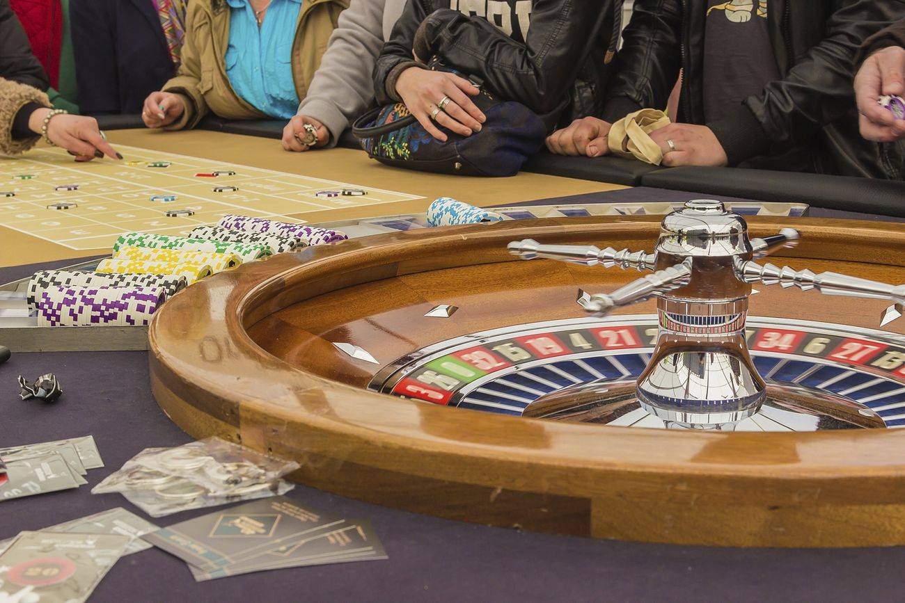 roulette-table-and-peoples-hands-on-the-table