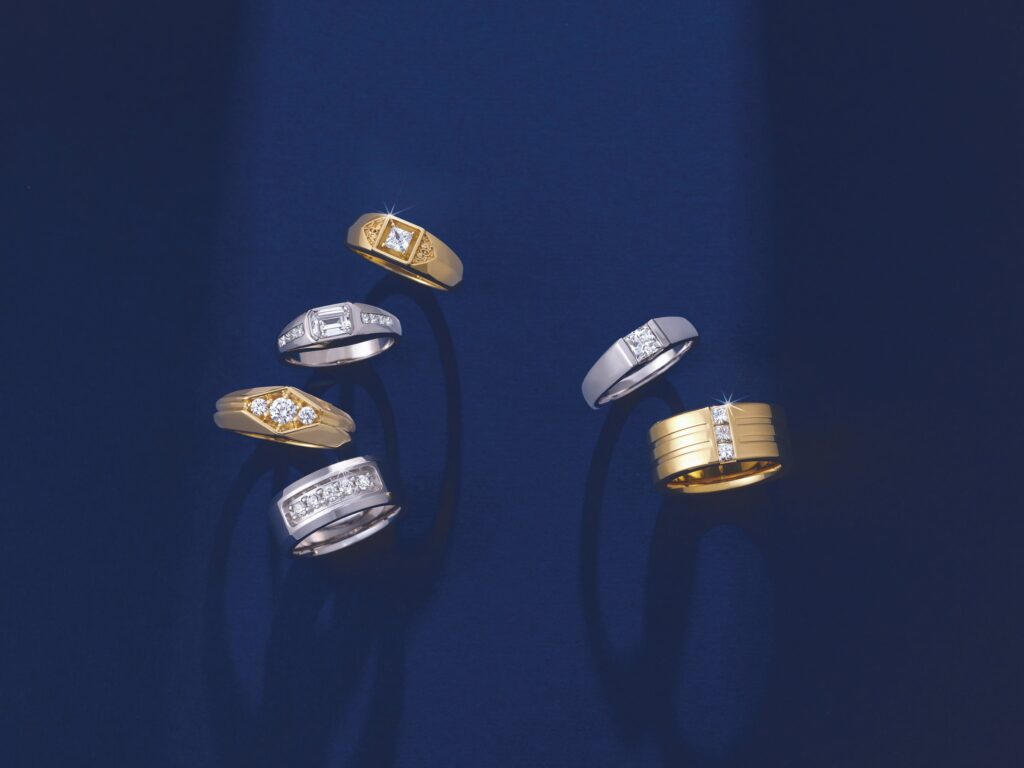beautiful-mens-wedding-rings-with-diamonds-against-blue-background